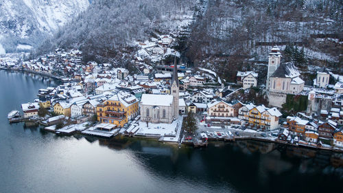 Aerial view of townscape by river during winter