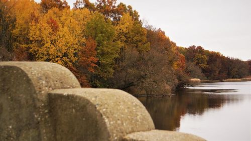 Scenic view of lake against sky during autumn