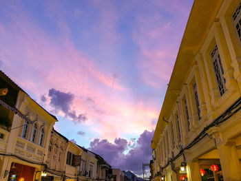 Low angle view of buildings against sky during sunset