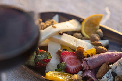 Close-up of chopped fruits in bowl on table