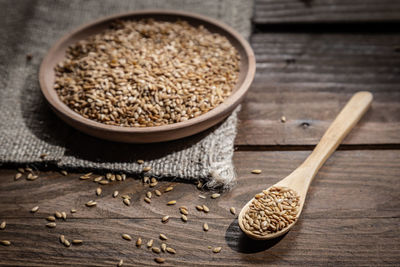 High angle view of wheat on wooden table