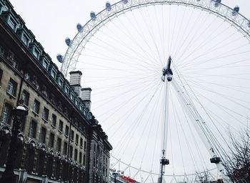 Low angle view of ferris wheel against sky