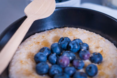 High angle view of blueberries on porridge
