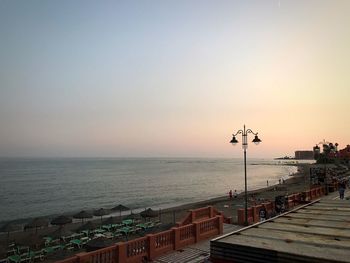 Scenic view of sea against clear sky during sunset