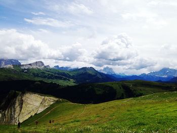 Scenic view of landscape against cloudy sky