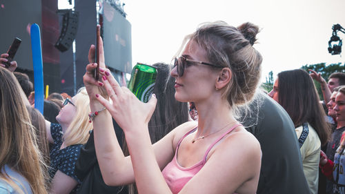 Portrait of young woman using mobile phone