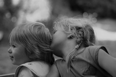 Close-up of mother and daughter outdoors