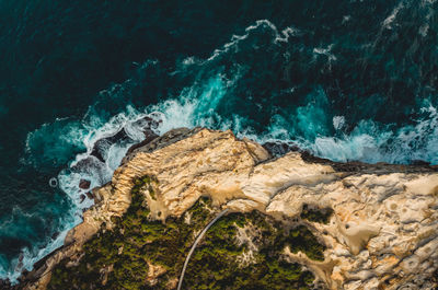 High angle view of rocks in sea