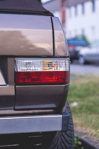 Close-up of red car on road