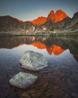 Scenic view of lake against sky during sunset