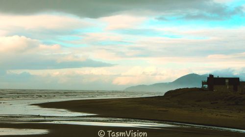Scenic view of beach against sky