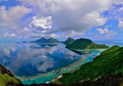 Scenic view of sea against cloudy sky