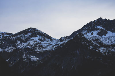 Scenic view of snowcapped mountains against clear sky