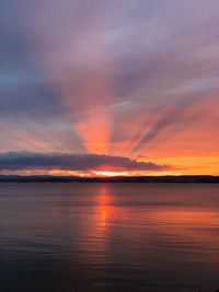 Scenic view of sea against romantic sky at sunset