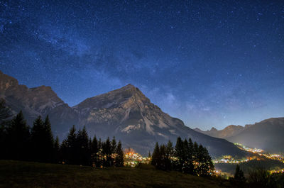 Scenic view of mountains against sky at night