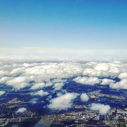 Aerial view of landscape against cloudy sky