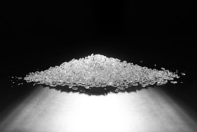Close-up of snow over black background