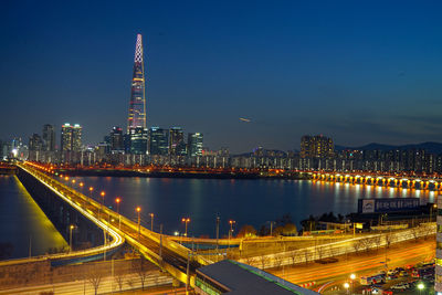 Illuminated modern buildings in city at night