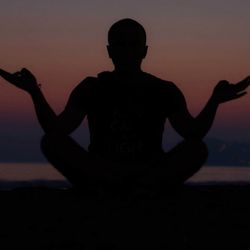 Silhouette of man against sunset sky