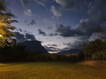 Scenic view of field against sky during sunset