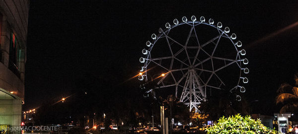 Low angle view of illuminated street light at night