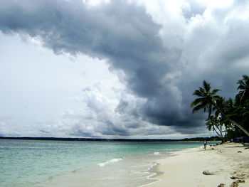 Scenic view of sea against dramatic sky