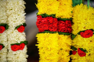 Close-up of multi colored flowers in market for sale