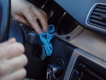 Close-up of hand holding car