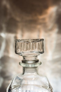 Close-up of glass bottle on table