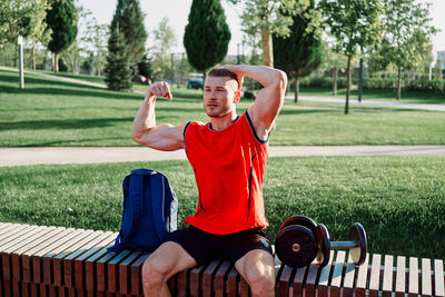 Full length of man sitting in park