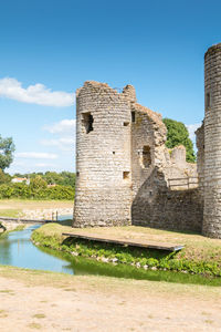 Old ruin building against blue sky