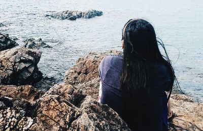 Rear view of woman looking at sea