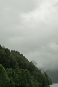 Scenic view of mountains against cloudy sky