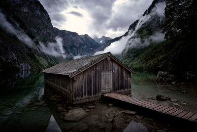 Scenic view of lake by buildings against sky