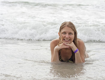 Portrait of young woman in sea