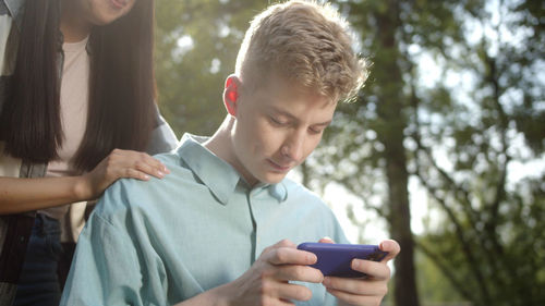 Young woman using mobile phone