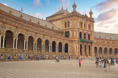 Group of people in front of historical building