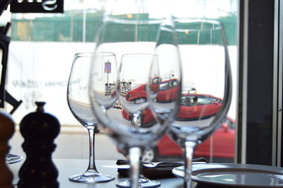 Close-up of wineglasses on table