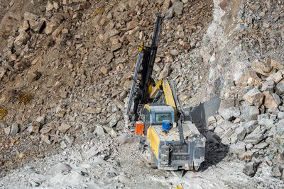 Drilling machine in open cast mining quarry