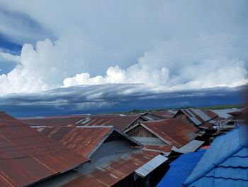 High angle view of roof and houses against sky