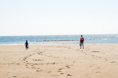 Wide angle of two children on beach