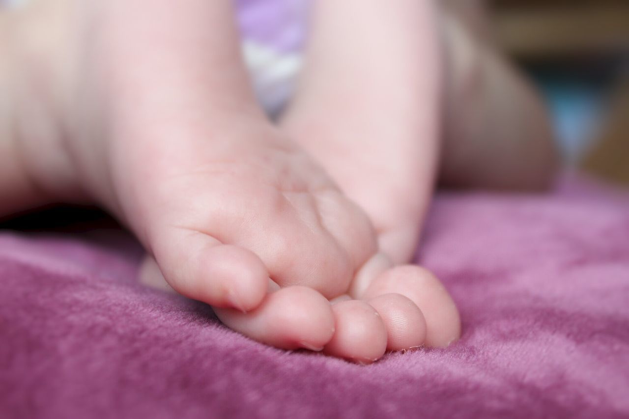 indoors, baby, babyhood, person, unknown gender, childhood, bed, innocence, newborn, lifestyles, family with one child, bonding, togetherness, close-up, toddler, relaxation