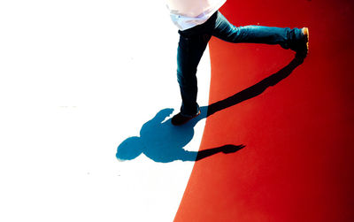 Low section of man against white background