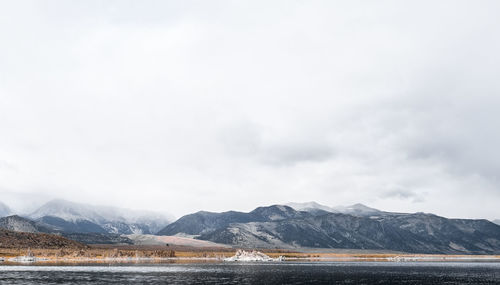 Scenic view of lake against cloudy sky