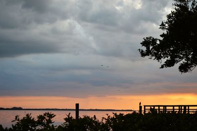Scenic view of dramatic sky over sea during sunset