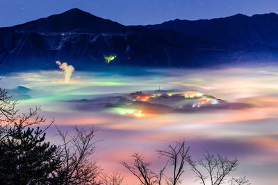 Scenic view of silhouette mountains against sky at sunset