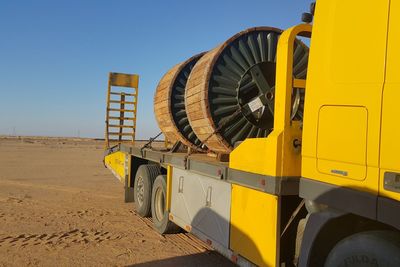 Conductor drums loaded on yellow track 