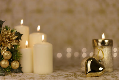 Close-up of illuminated tea light candle