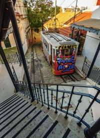 High angle view of empty street amidst buildings in city