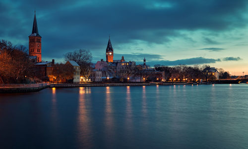 View of illuminated city at waterfront